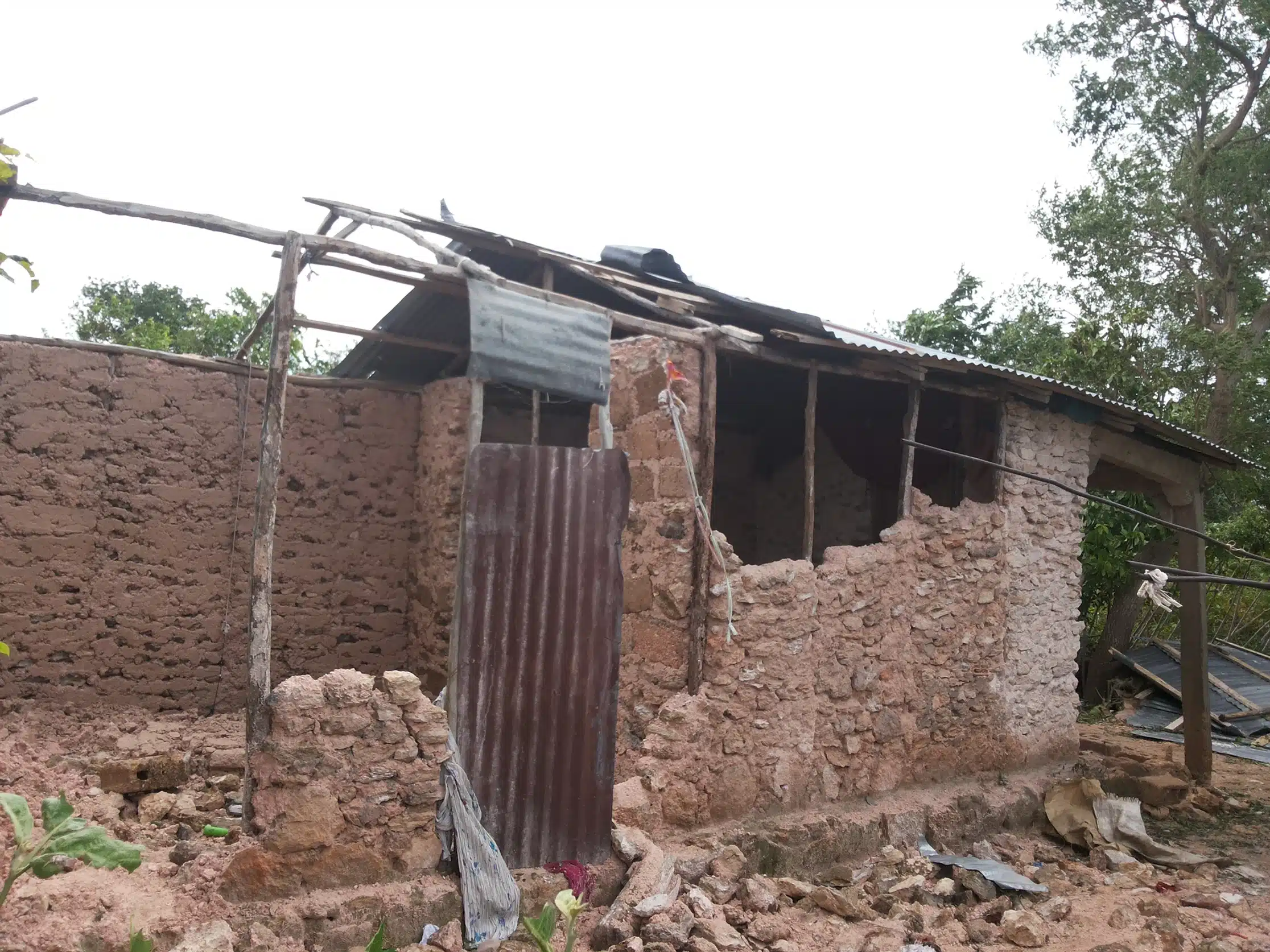 A damaged house in need of repair and rebuilding.