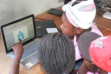 Making houses with geometric shapes in Makanaki’s computer class.