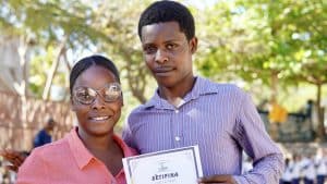An MCLC staff member with her certificate for International Women's Day